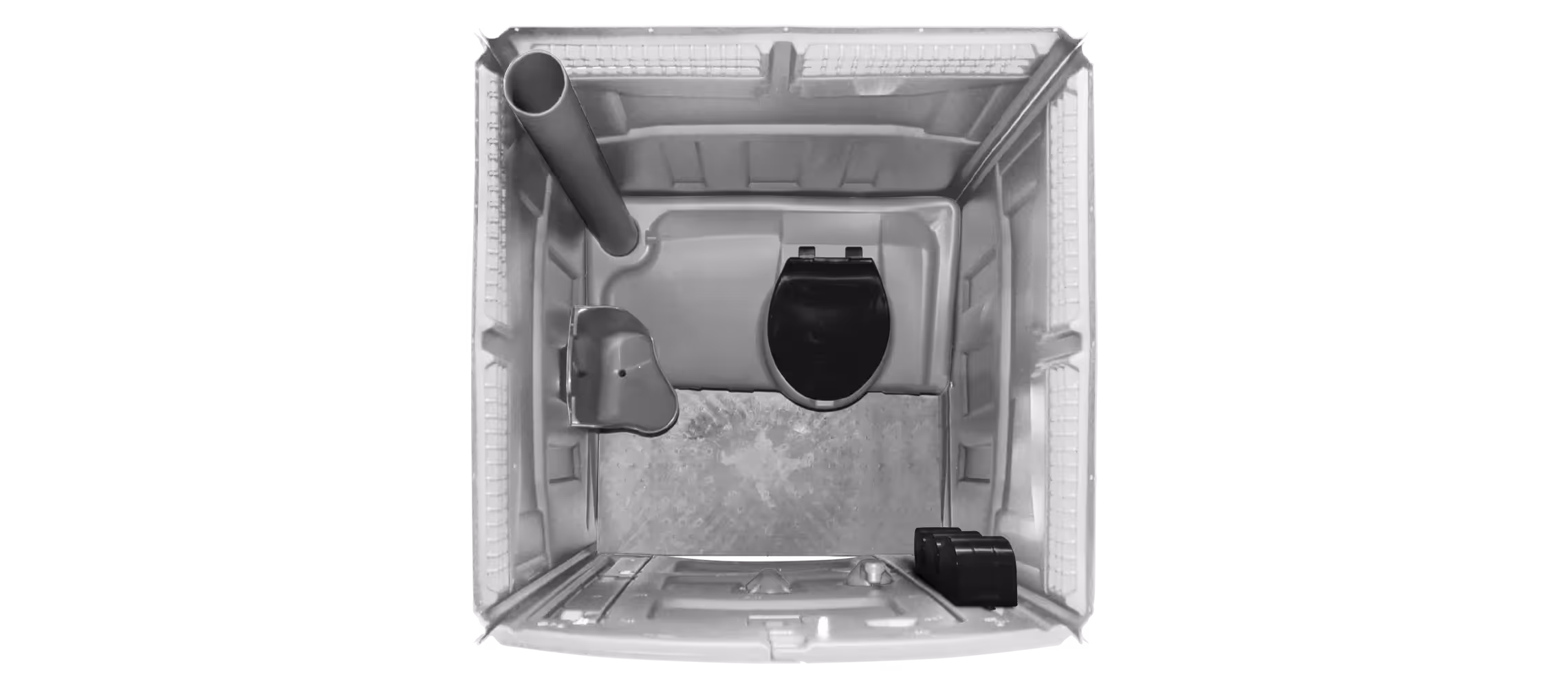 Top view of a portable toilet interior showing a toilet seat, pipe, and floor.