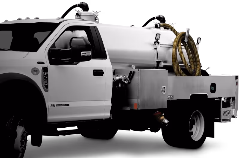 White utility truck with a metal tank and coiled yellow hoses on the back.