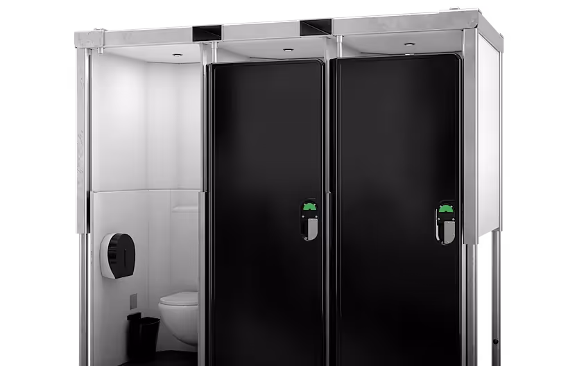 Modern portable restroom unit with two black doors and one open stall showing toilet and paper dispenser.