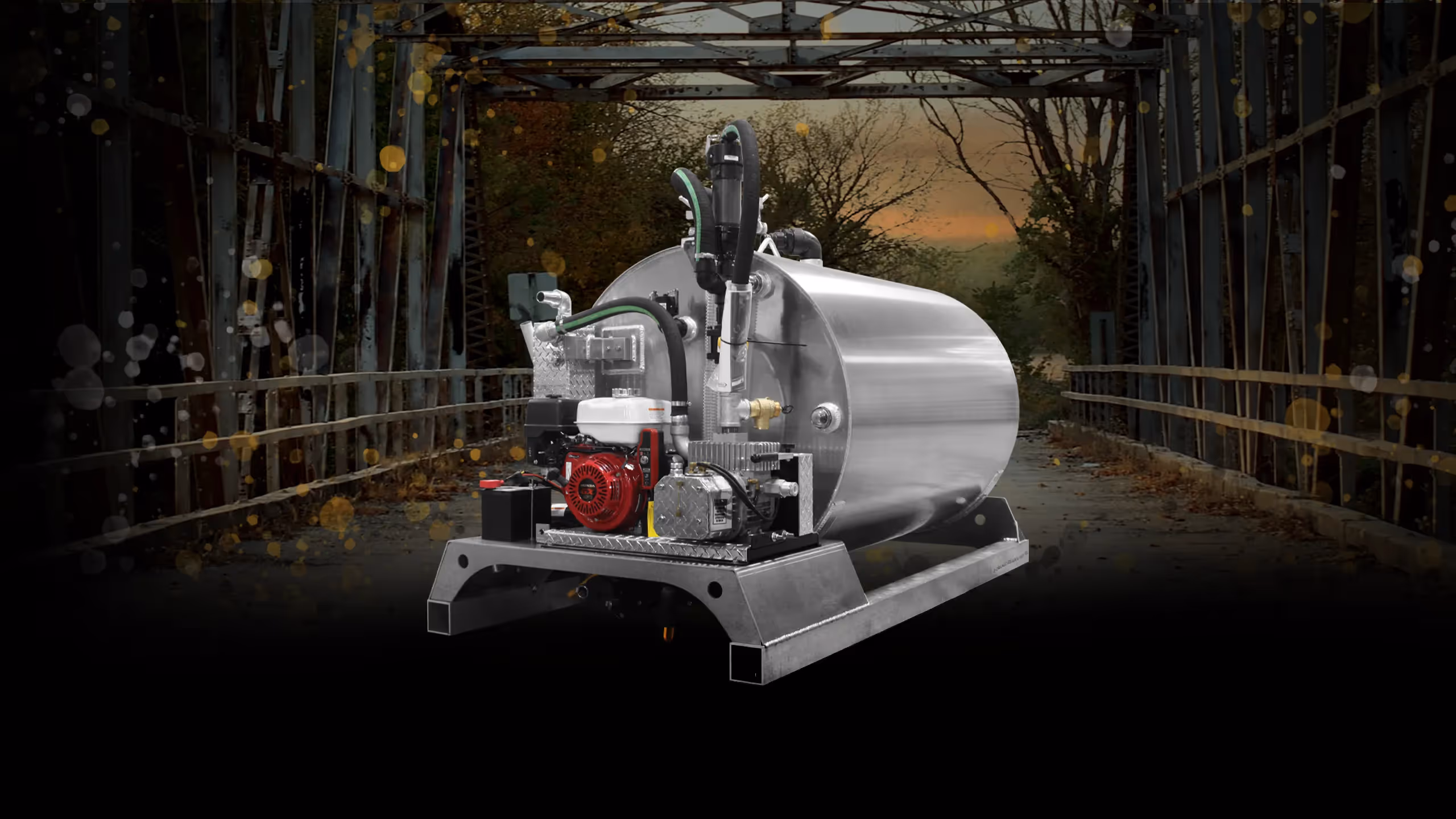 A stainless steel 650 Slide-in unit with a motor and tank, displayed on a bridge backdrop.