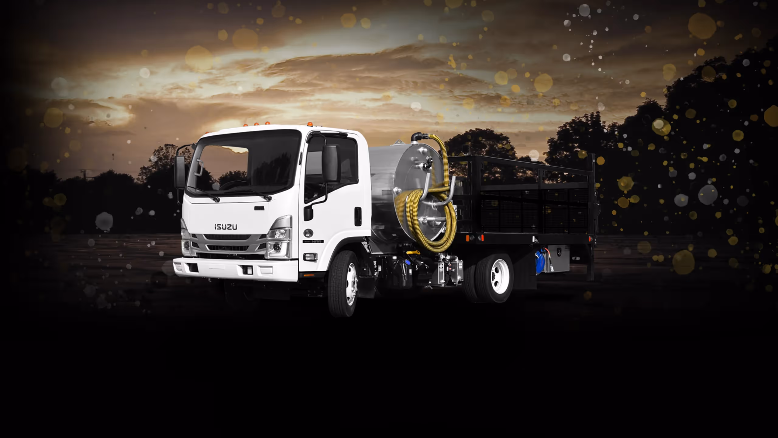 White Isuzu Cabover P&D700 truck with a large yellow reel, set against a dark, sparkly background.