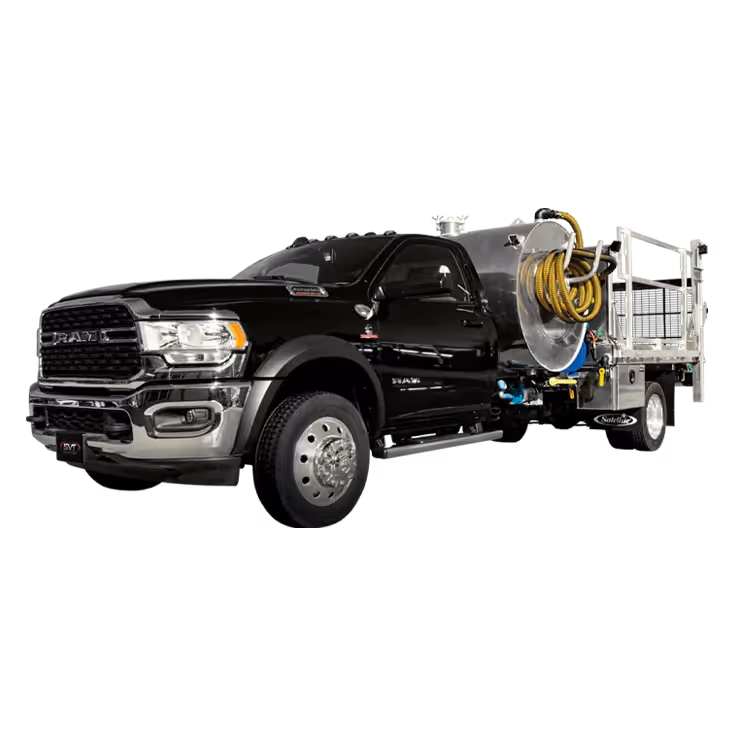 Black RAM heavy-duty flatbed truck with mounted tank and coiled hose reel on the back.