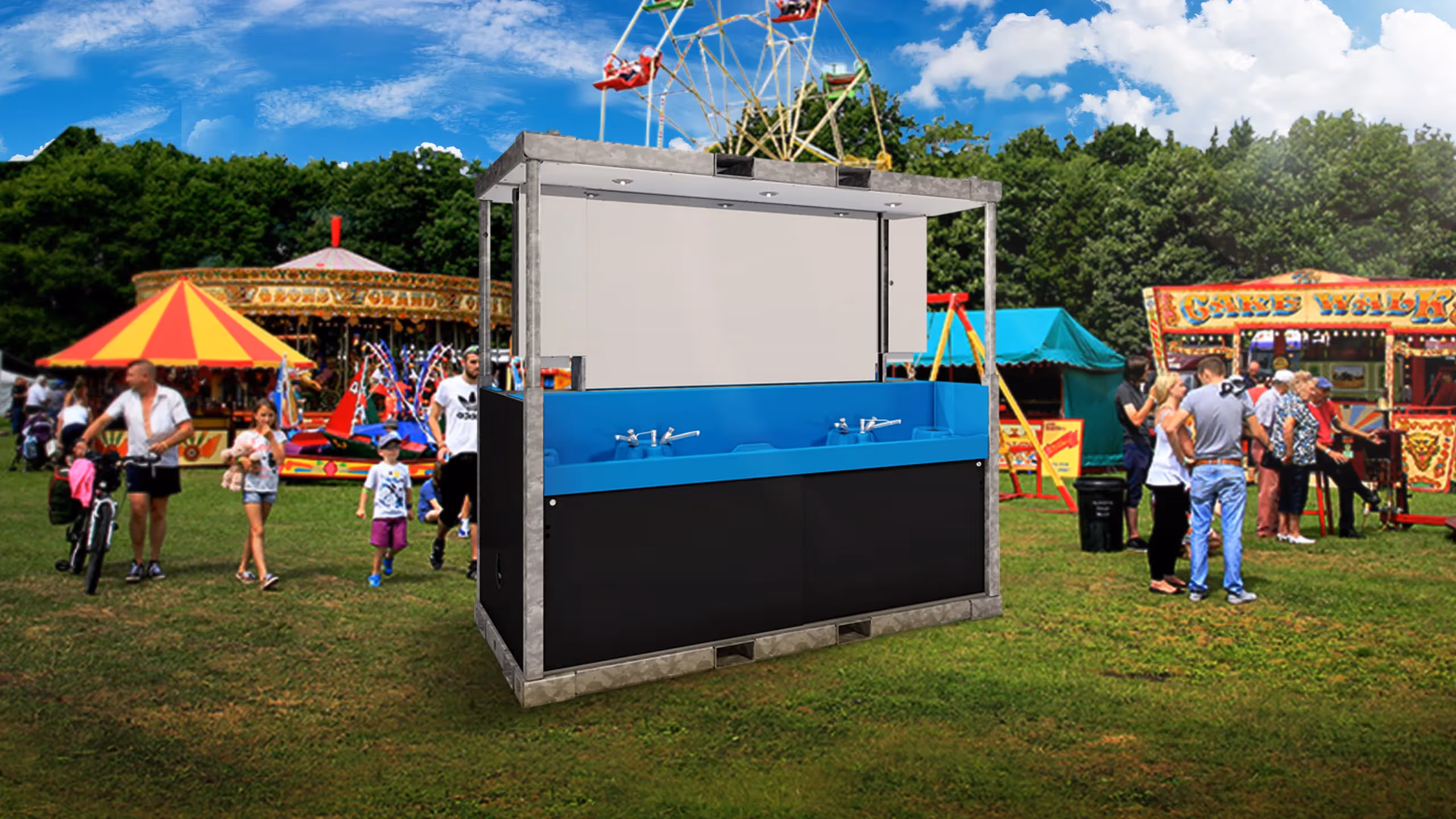 Sanitrax Washbasin Module in a fairground, with rides and visitors in the background.