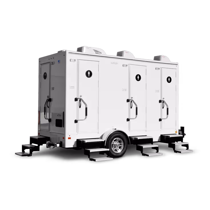 Portable restroom trailer featuring four doors and four stations, set on a wheeled chassis.