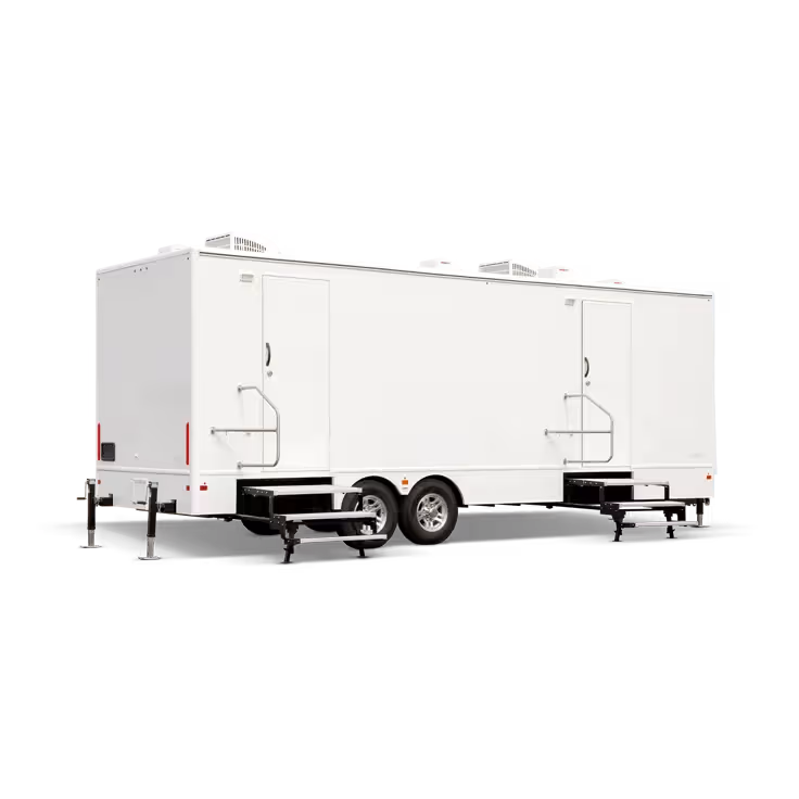 White 9-station restroom trailer with steps, two doors, and air conditioning units on top.