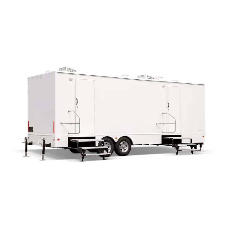 White 10-station restroom trailer with two entrances and extended stairs for access.
