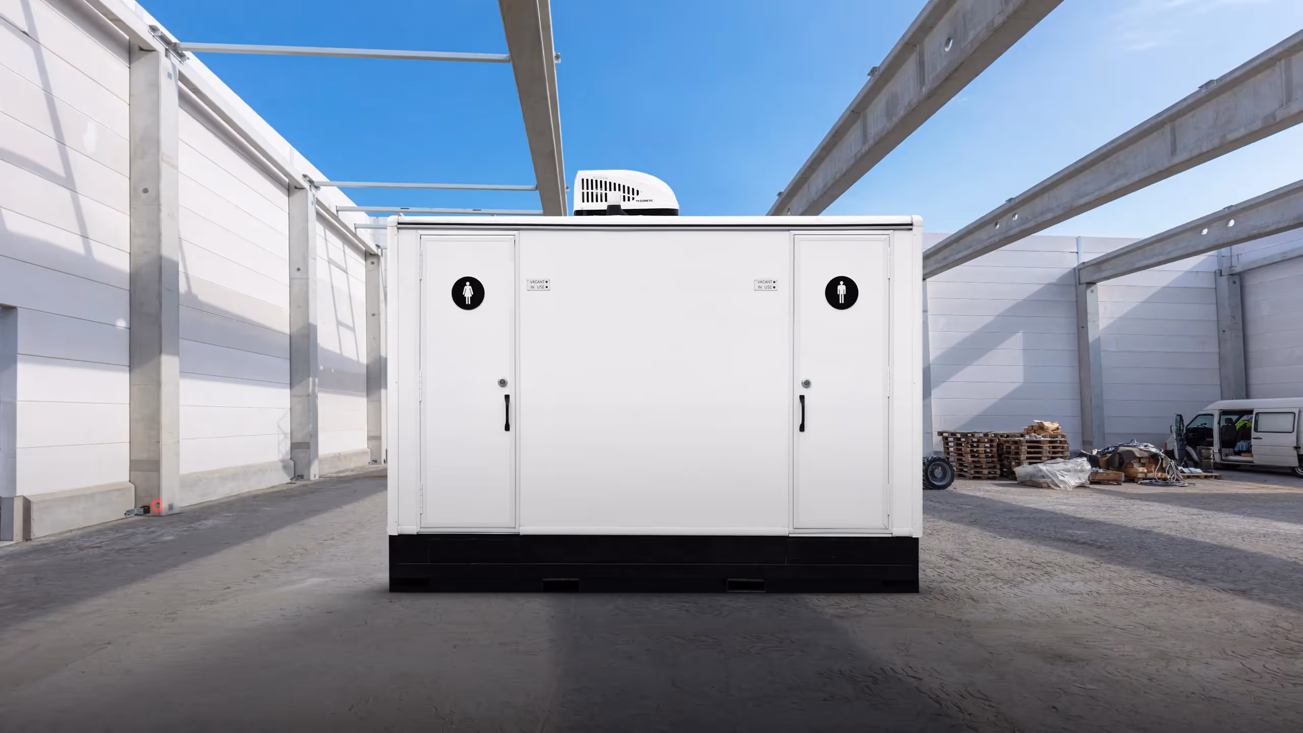 Selfie POD 2-Station enclosed in a spacious warehouse, featuring two access doors and bright