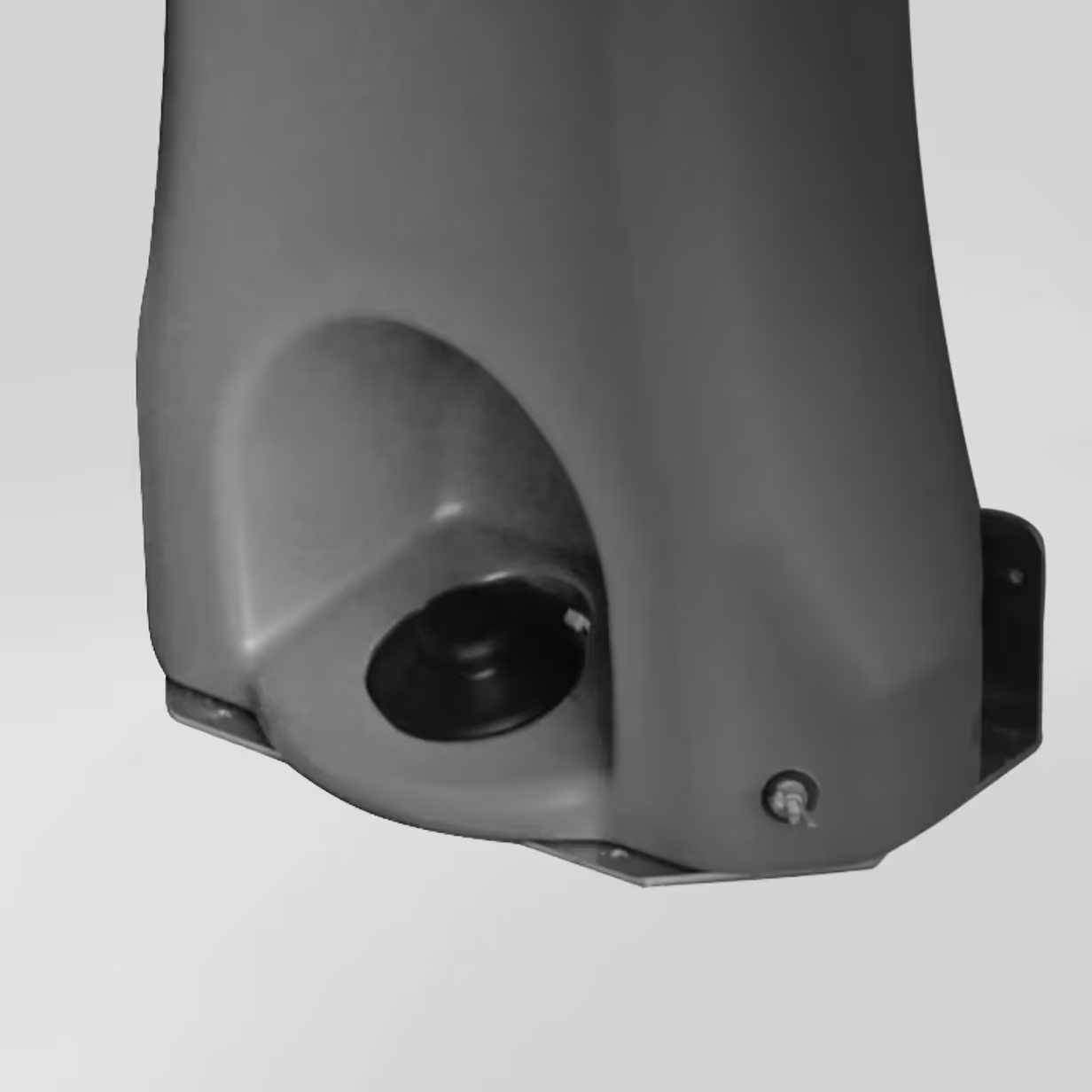 Close-up of the base of a gray industrial pump with a black circular component.