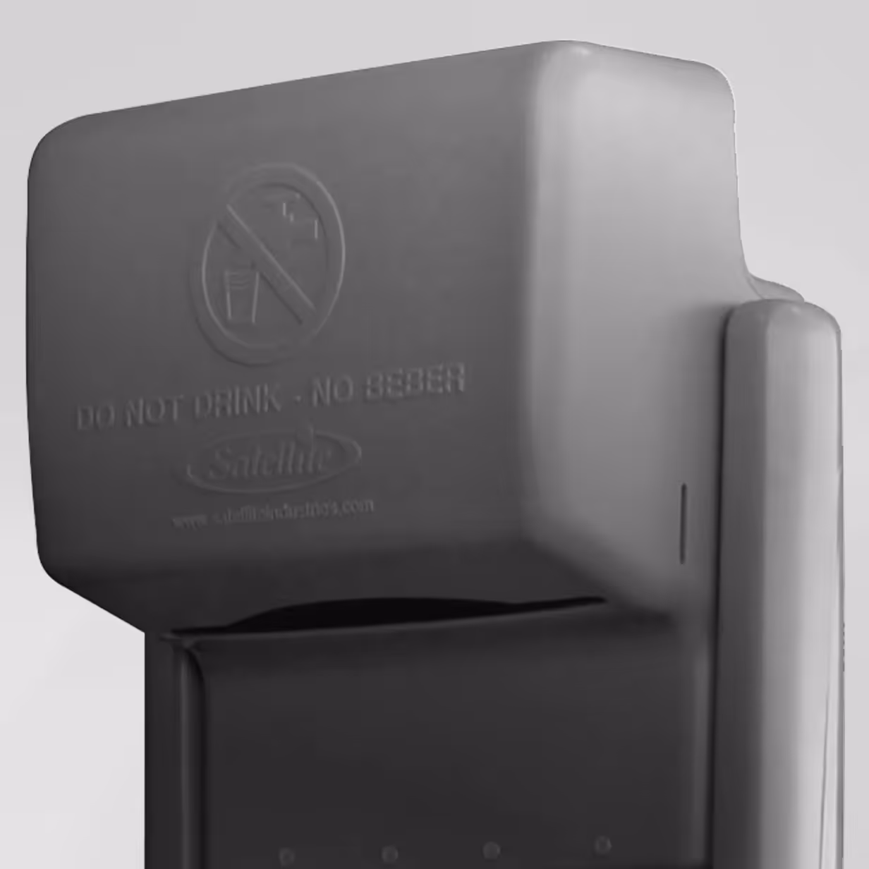 Close-up of dark gray water dispenser with no drinking symbol and text 'DO NOT DRINK - NO BEBER'.