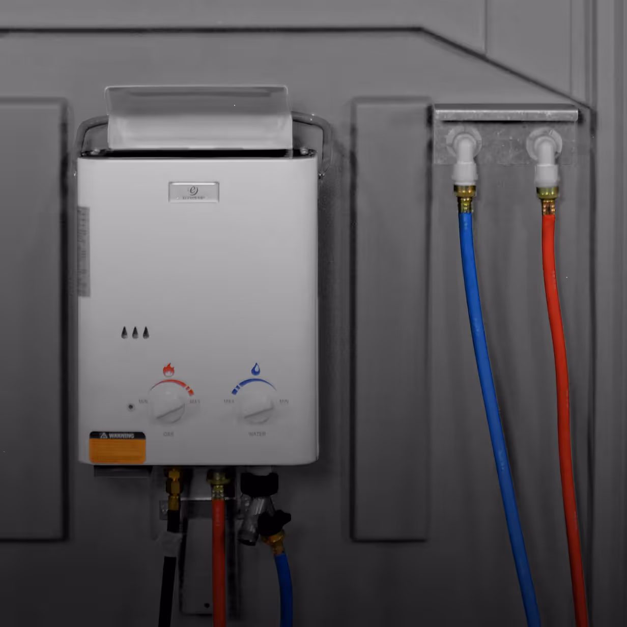 Wall-mounted water heater with gas and water control knobs and connected red and blue pipes.