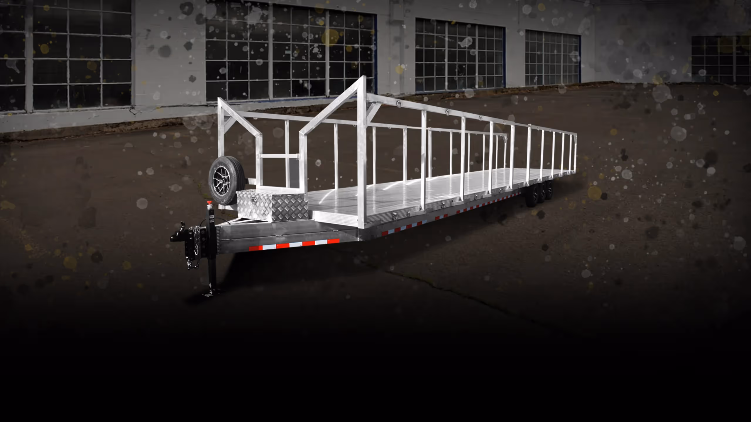 Pioneer 20 trailer featuring a long aluminum bed and a tubular frame, set against a dark background.