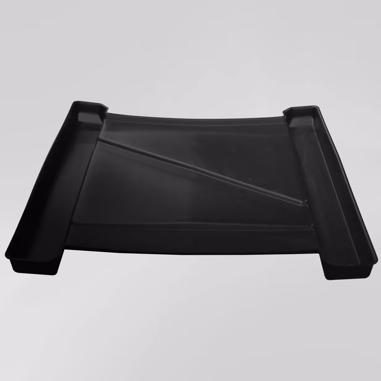 Black rectangular plastic containment tray with raised edges and angled ridges in the base.