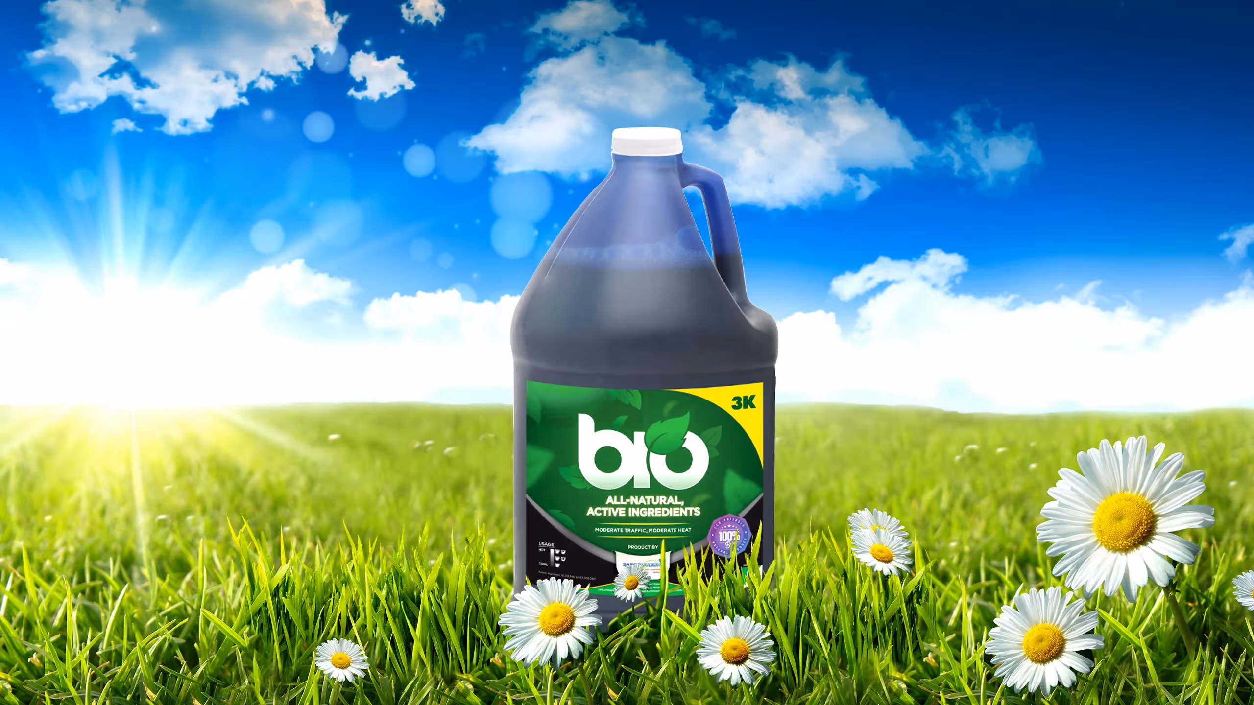 A gallon jug of BIO 3K all-natural active ingredients on green grass with daisies and a sunny sky.