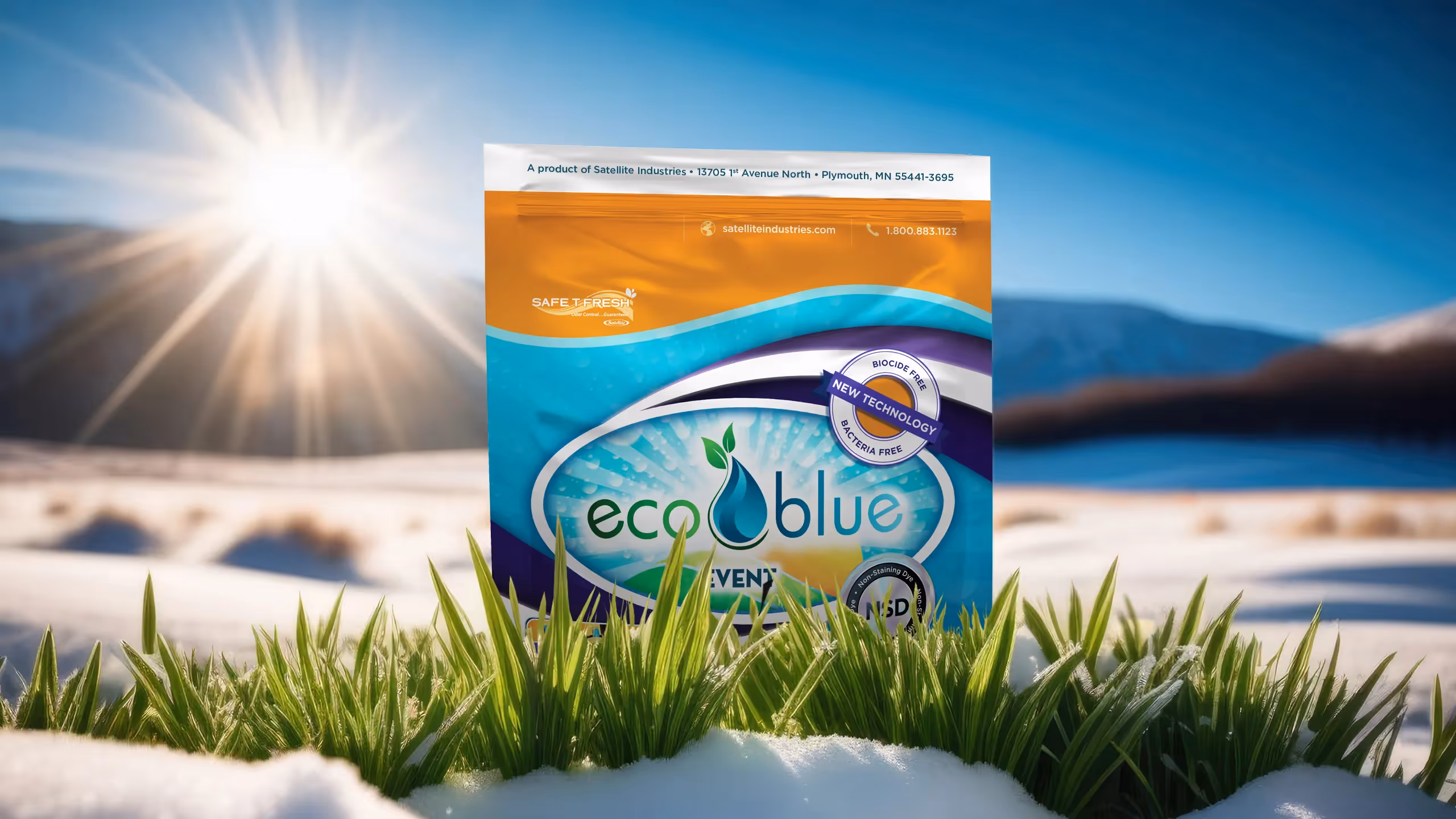 Eco Blue product package in grass with snow and sun shining in blue sky background.