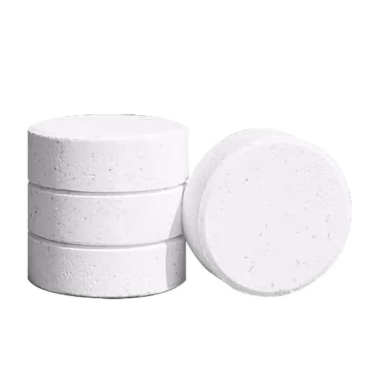 Four stacked white chlorine tablets on a black background.