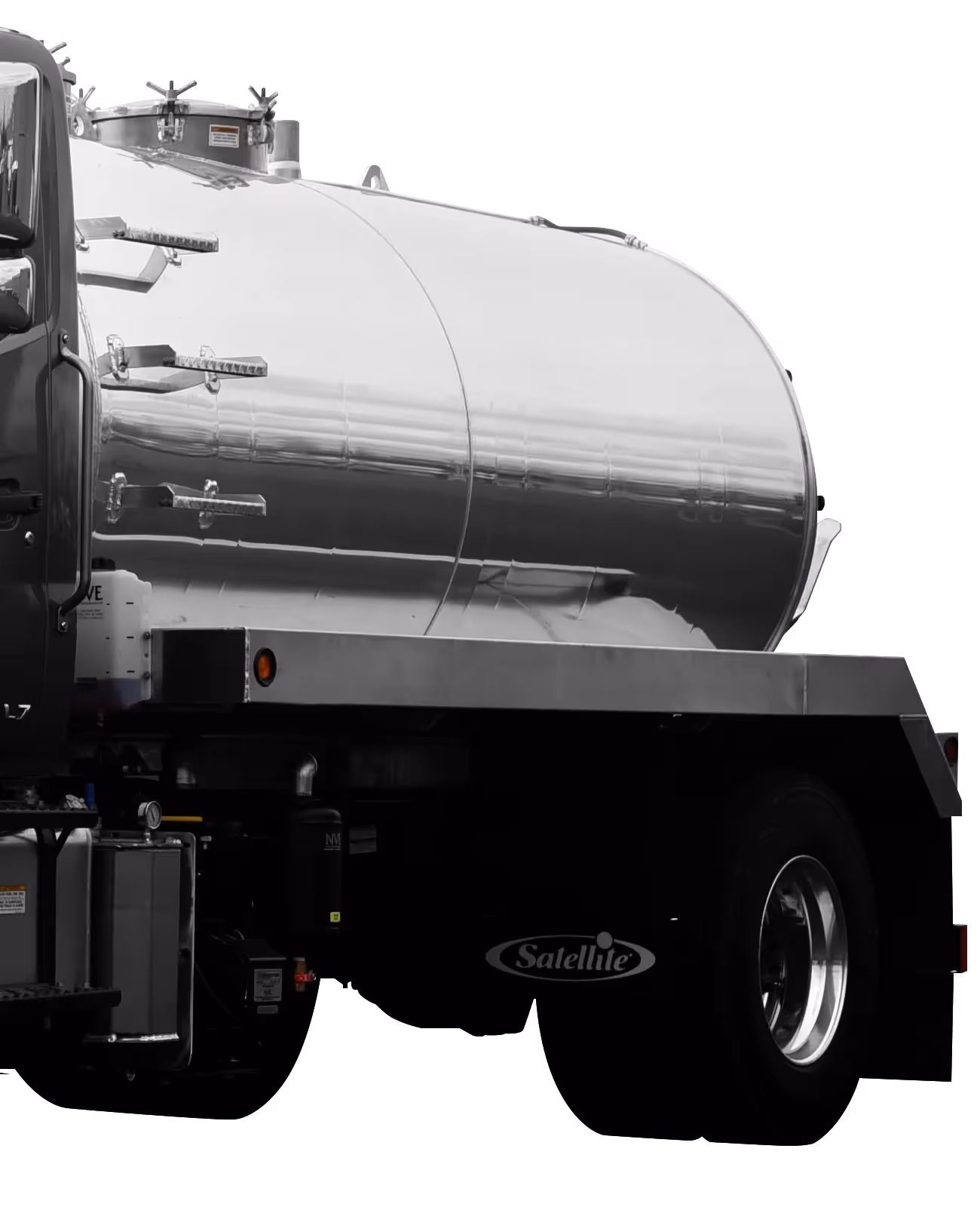 A metallic tanker truck with a shiny, cylindrical tank mounted on a dark background.