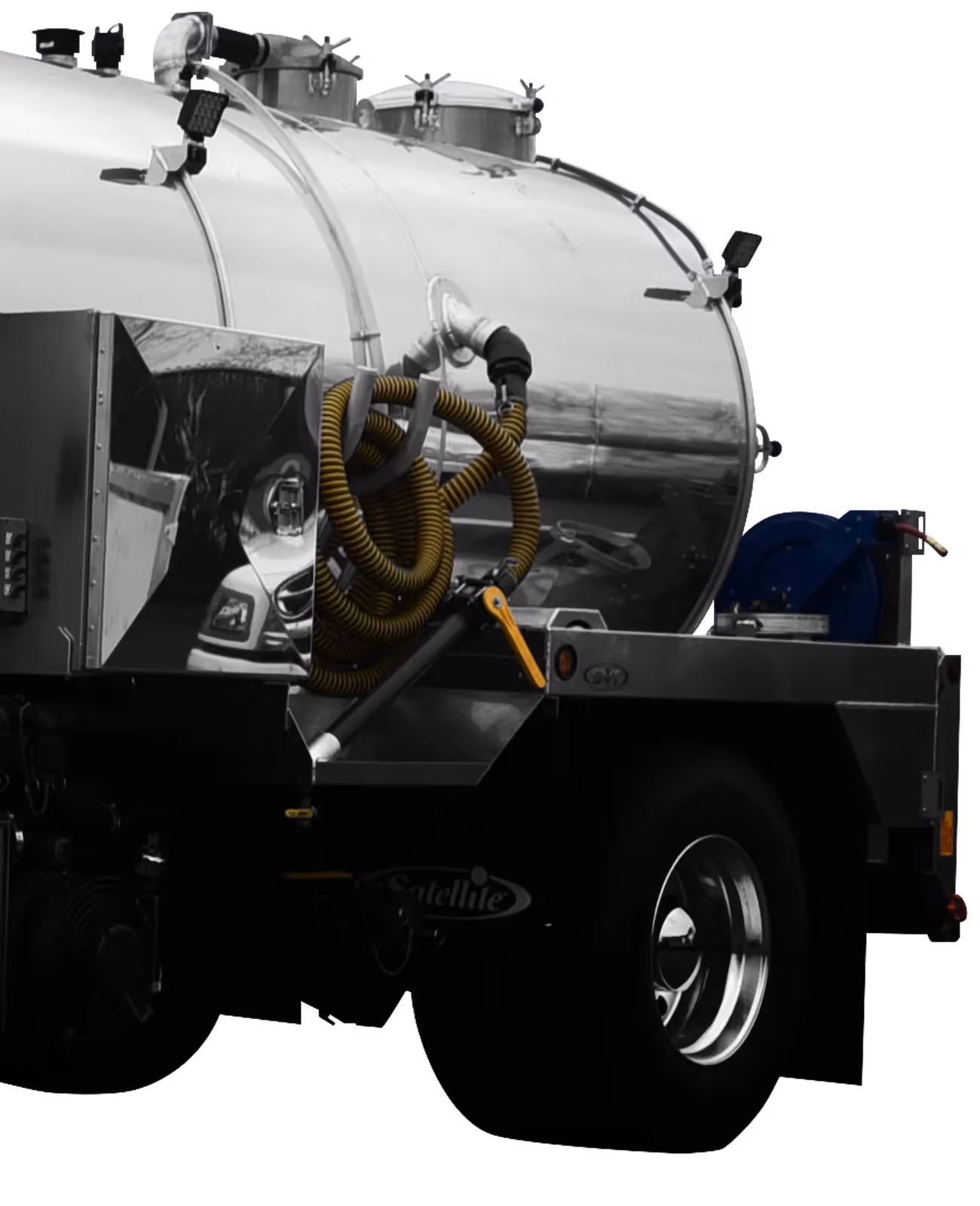 Polished silver tank trailer with yellow hoses and a blue component attached.