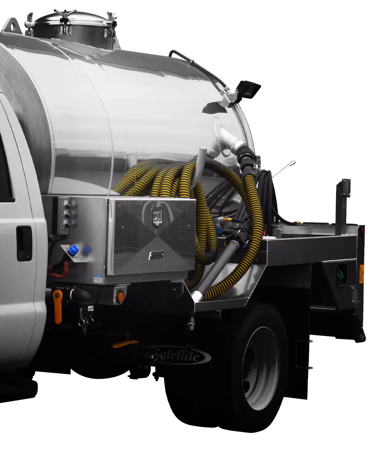 Tank truck with metal body and yellow hoses, designed for liquid transportation.