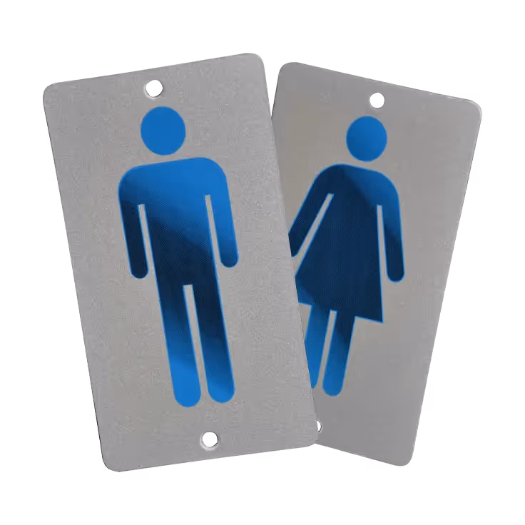 Two gender indicator signs—one for male with a blue icon, and one for female in a blue dress.