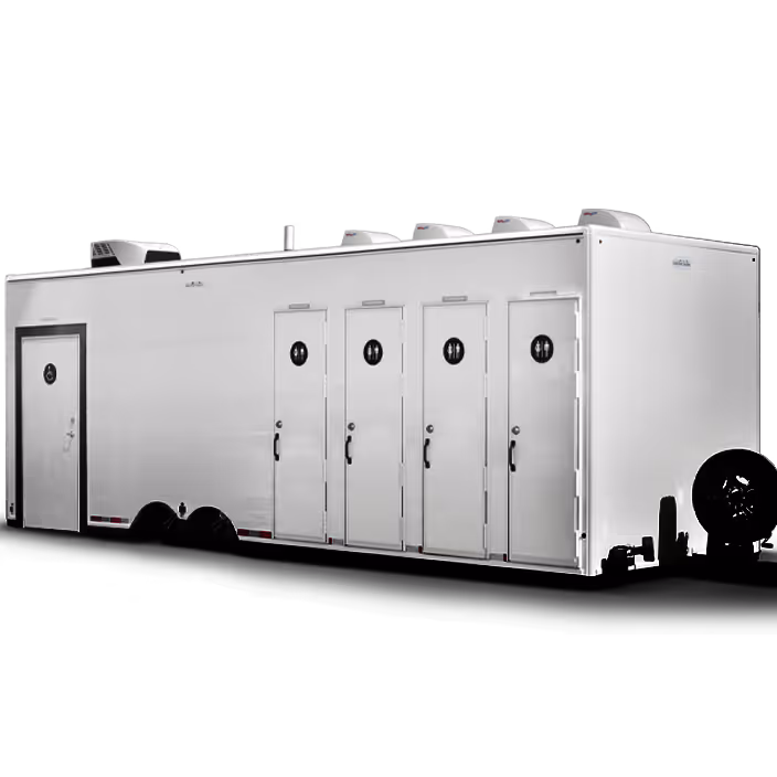 White portable restroom trailer with five locked doors and ventilation units on the roof.