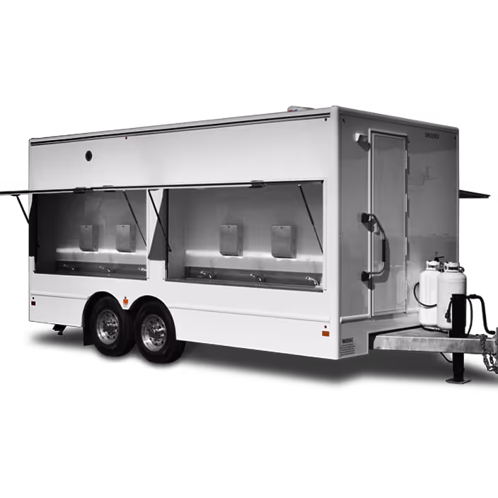 White mobile trailer with two open service windows and propane tanks attached at the front.