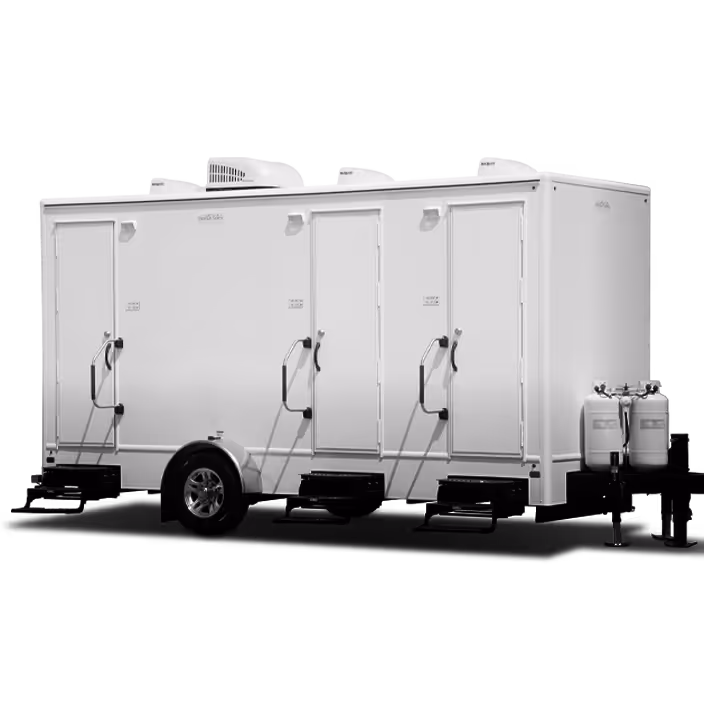 White portable trailer with three doors and propane tanks attached in front.
