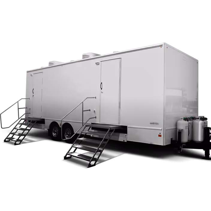 White mobile trailer with two doors, metal stairs, and attached propane tanks.