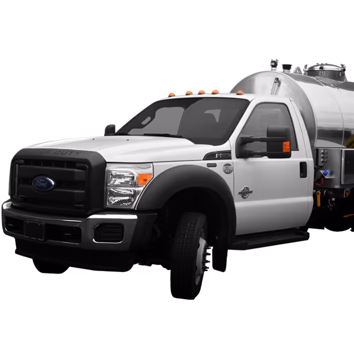 White Ford Super Duty truck with a large silver tank mounted on the back, angled front view.