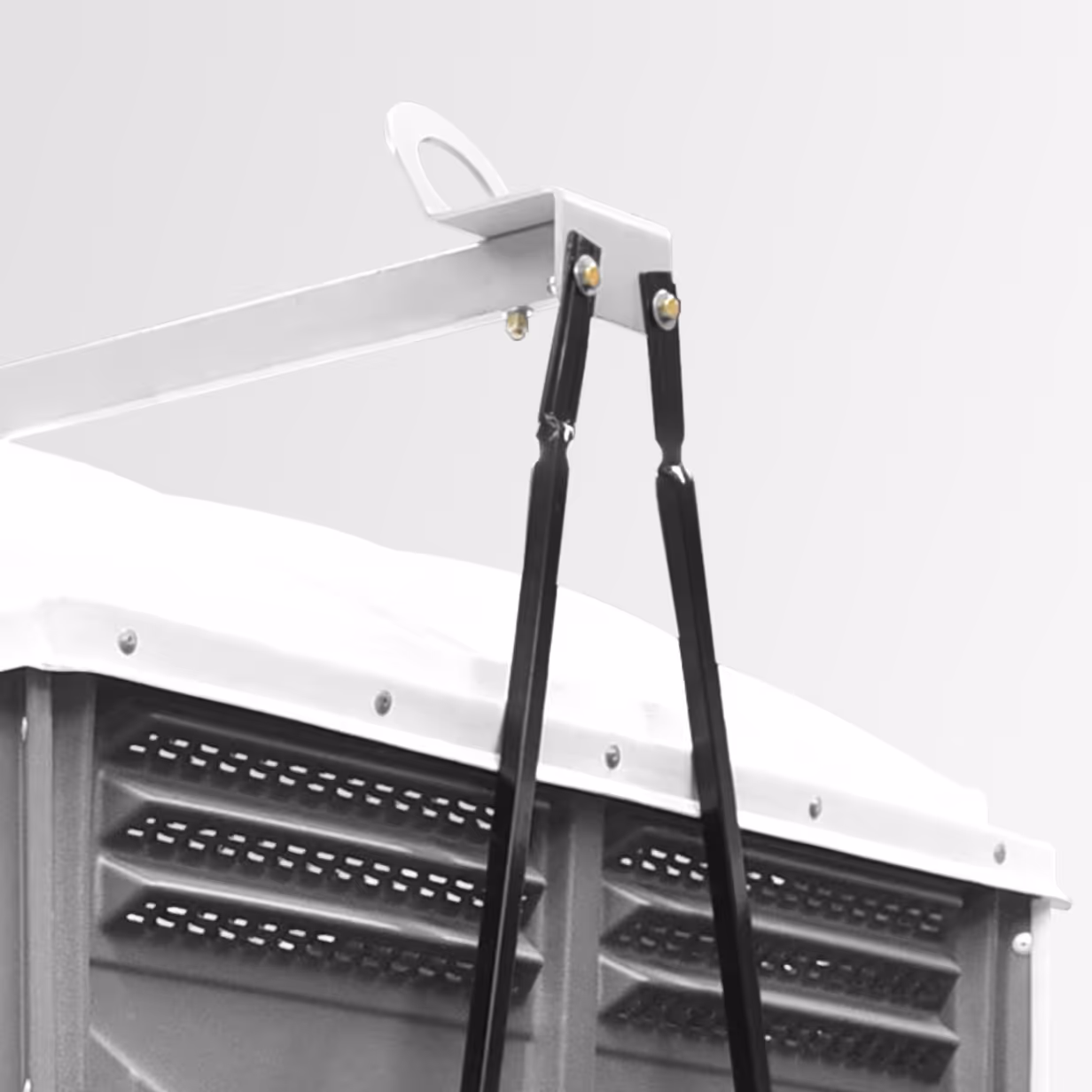 Close-up of a white metal lift kit bracket with black support straps attached to a vented panel.