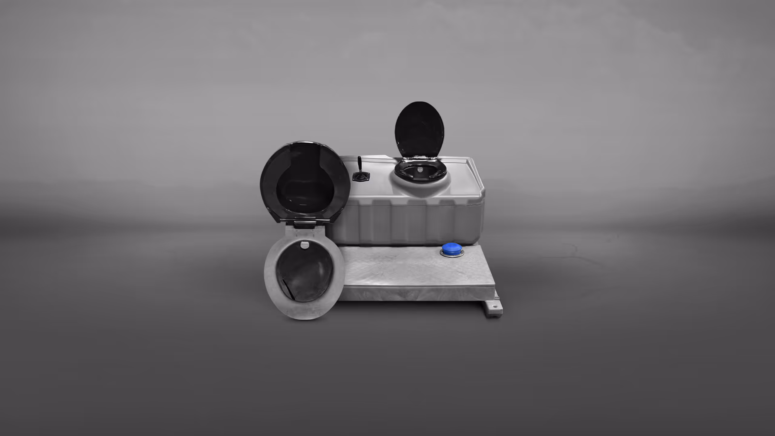 A gray portable toilet with two seating options, one black and one gray, on a flat base.