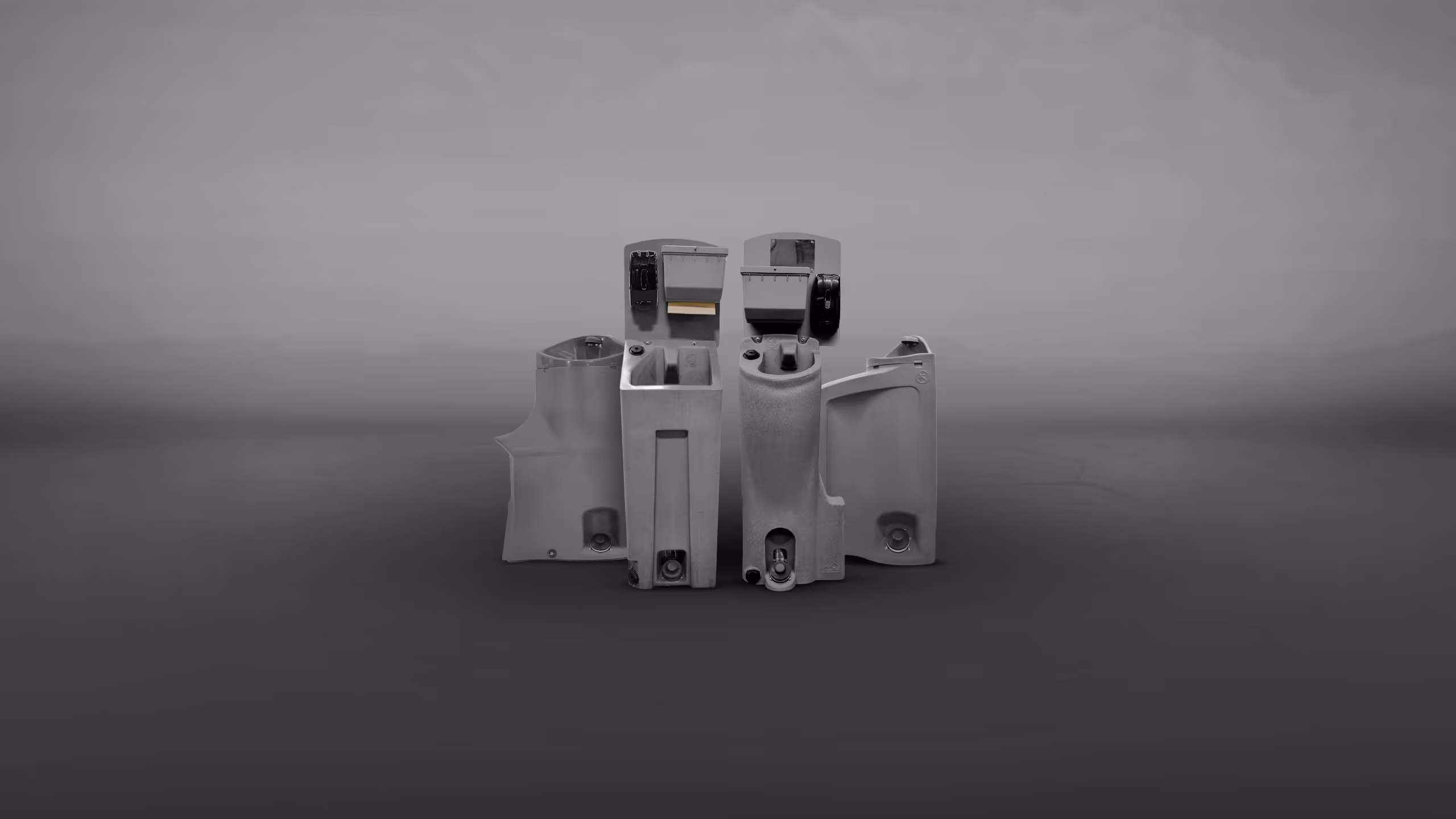 A gray mechanical component, possibly a part of machinery, shown from a front angle on a neutral