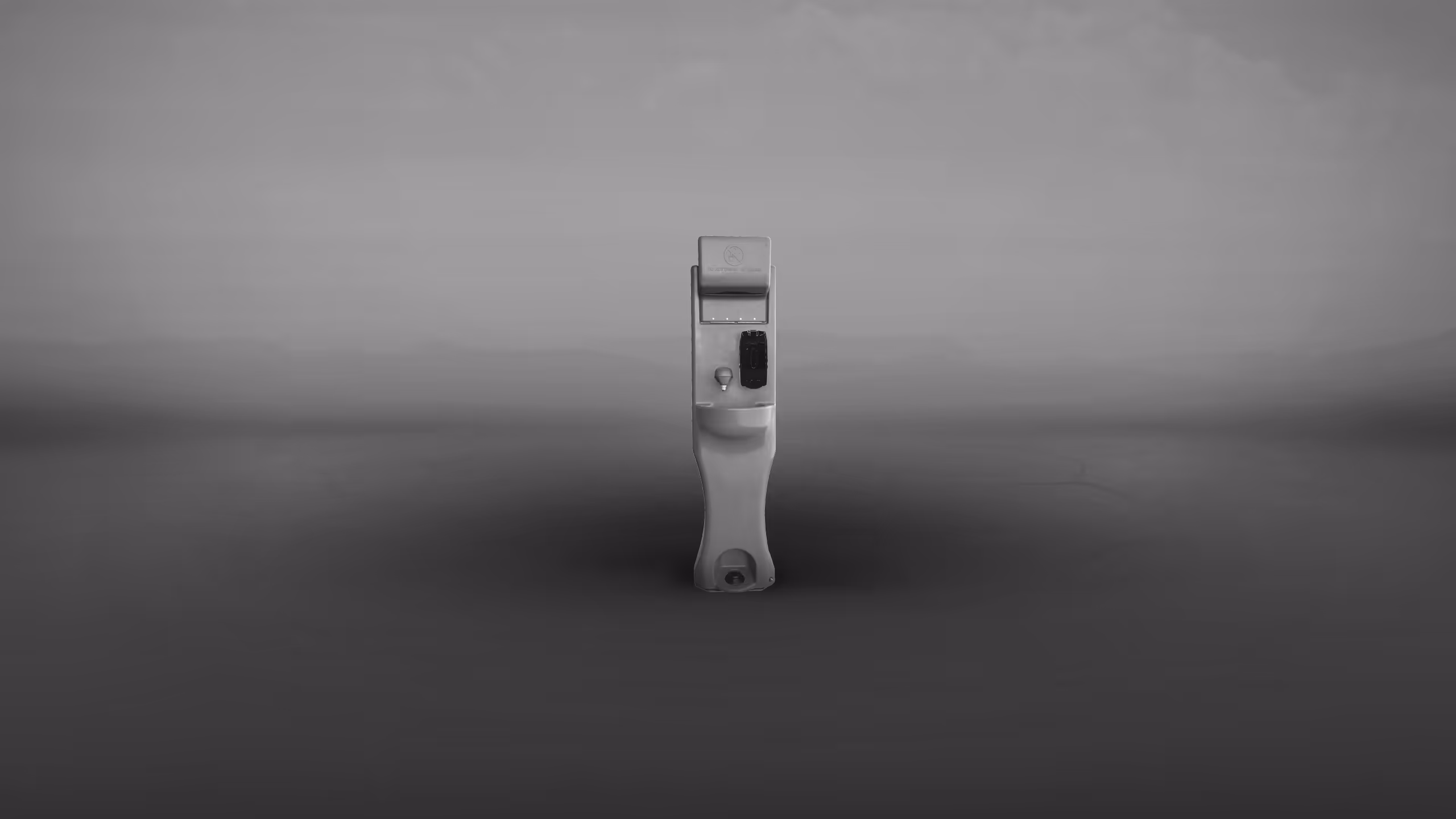 A gray-scale image of a single wall-mounted door latch against a blurred background.