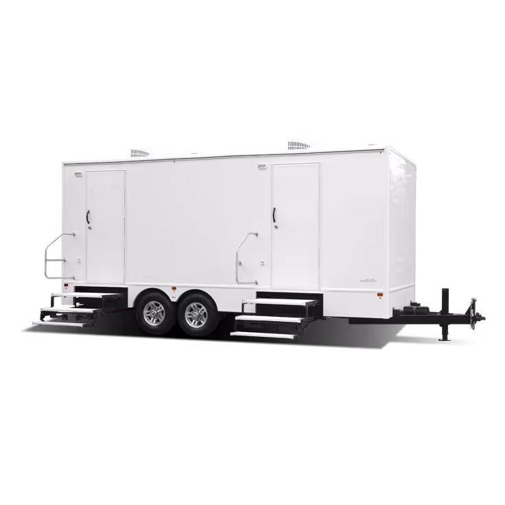 A white 8x17' trailer with two doors and six restroom stations on a flatbed.