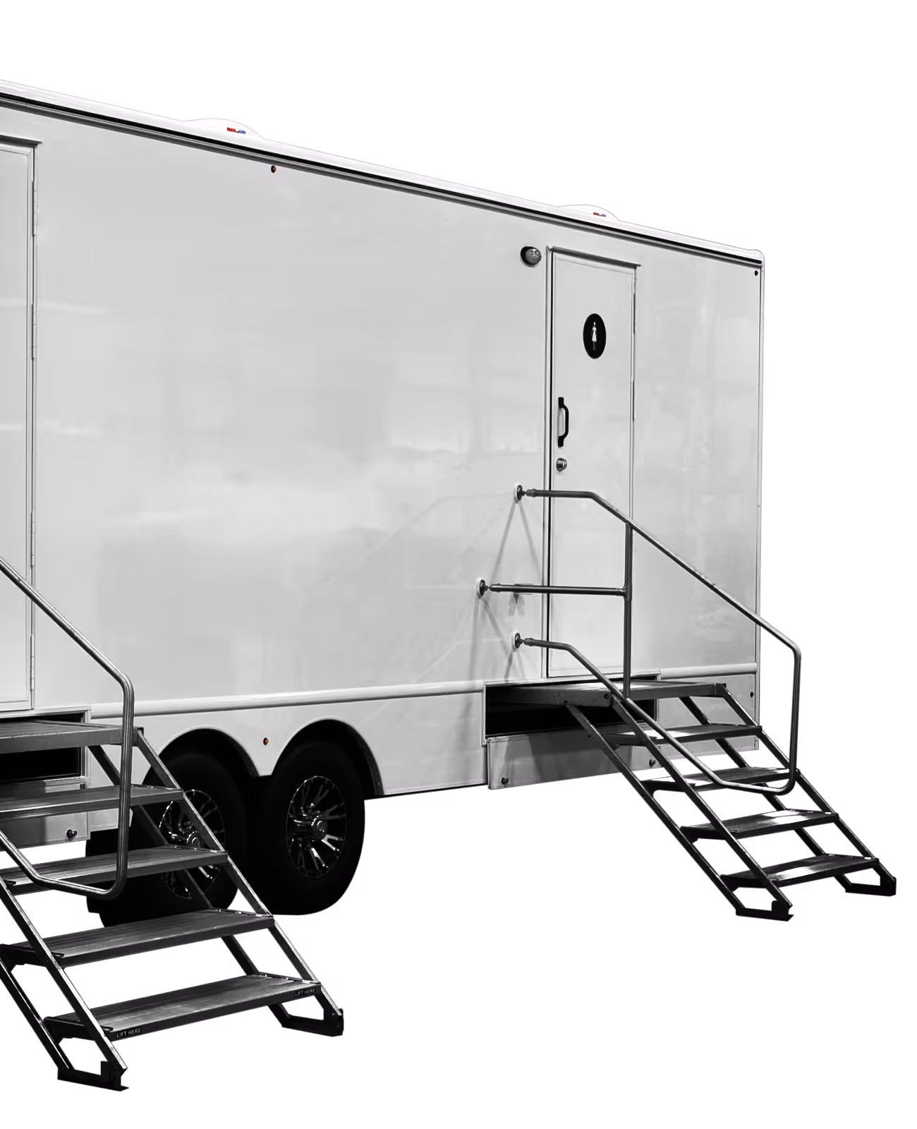 White 11-station restroom trailer with two staircases and a side door.
