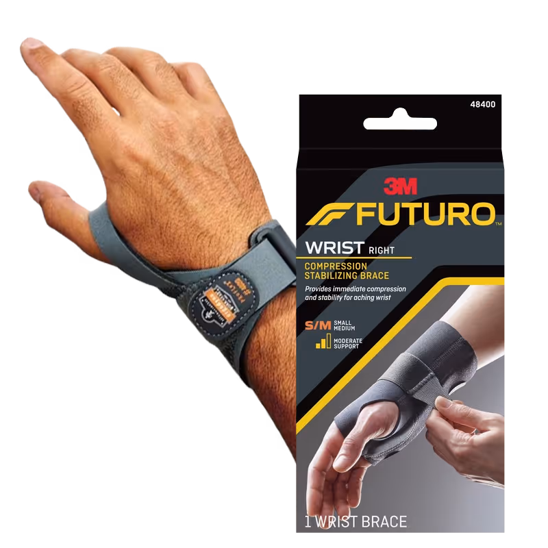 Wrist brace on a hand alongside its packaging, labeled "FUTURO Compression Stabilizing Brace."