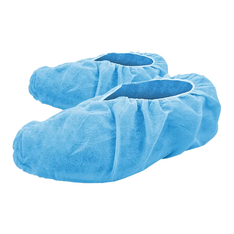 Blue disposable shoe covers made of non-woven material, designed for hygiene and protection.