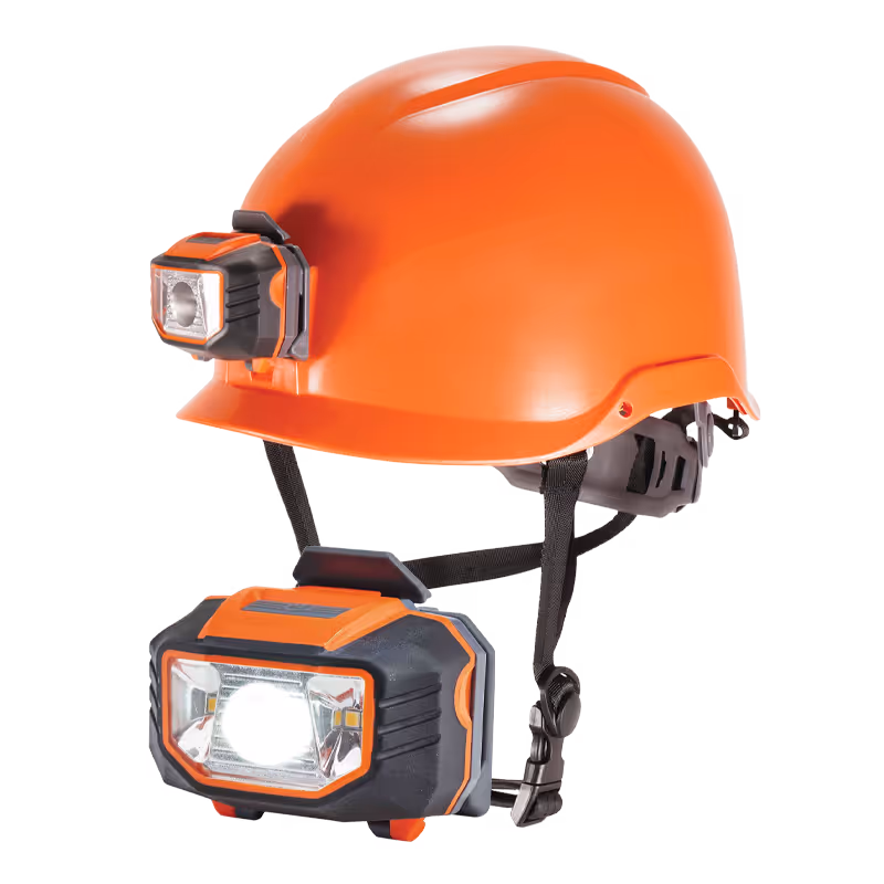 An orange safety helmet with two attached LED lights on the front and side.