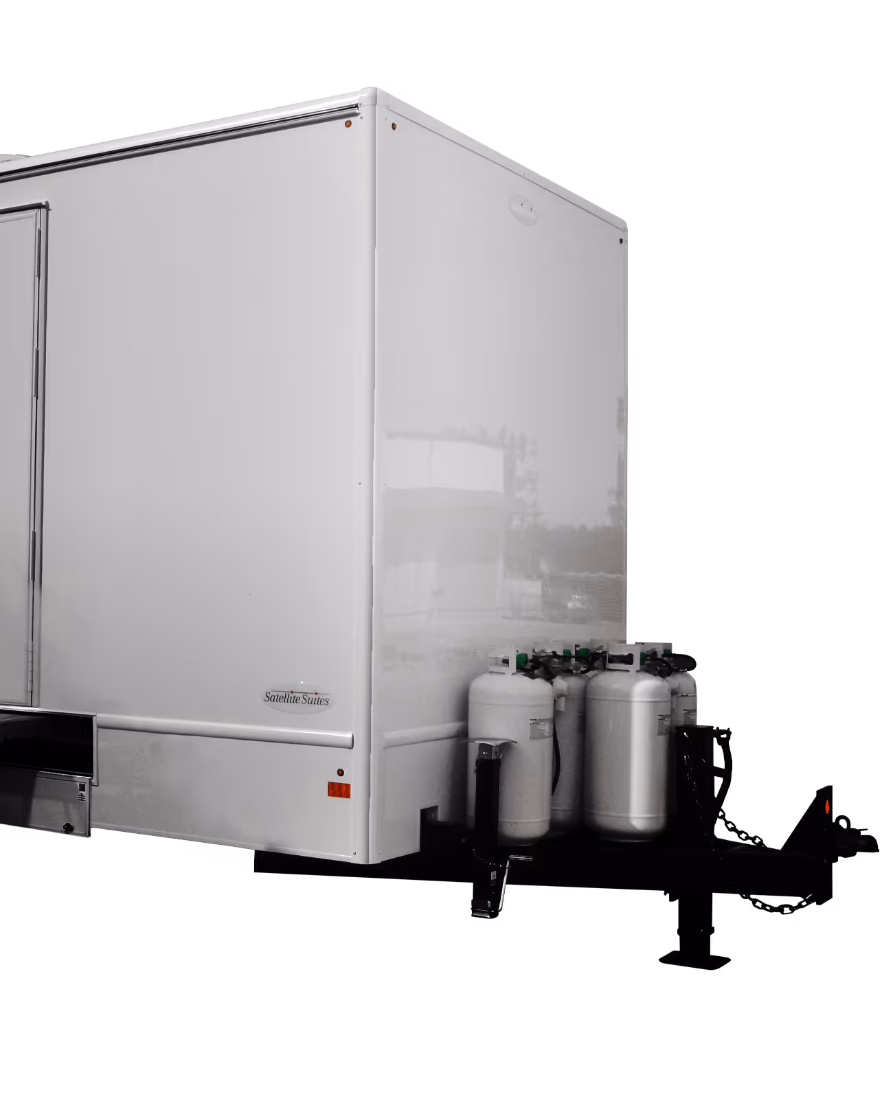 White laundry trailer with eight washing stations and propane tanks attached to the side.