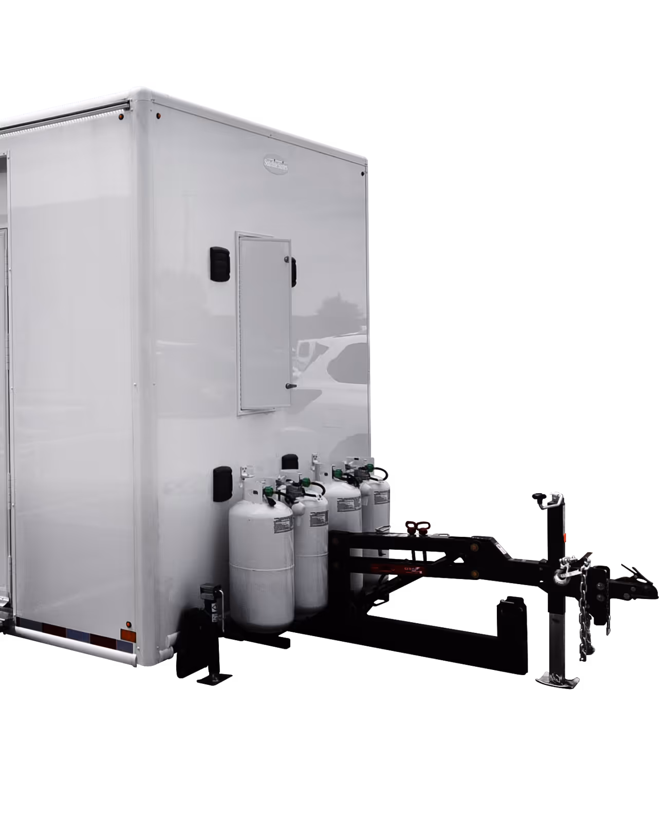White laundry trailer with two propane tanks, mounted on a heavy-duty hitch.
