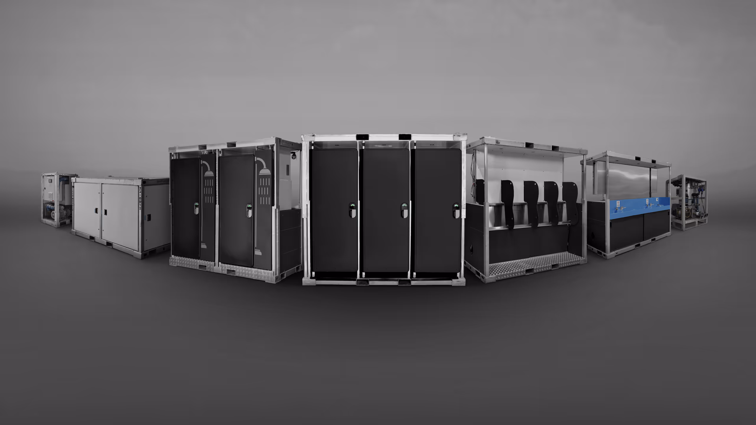 Several portable storage units arranged in a curved line, featuring different designs and colors.