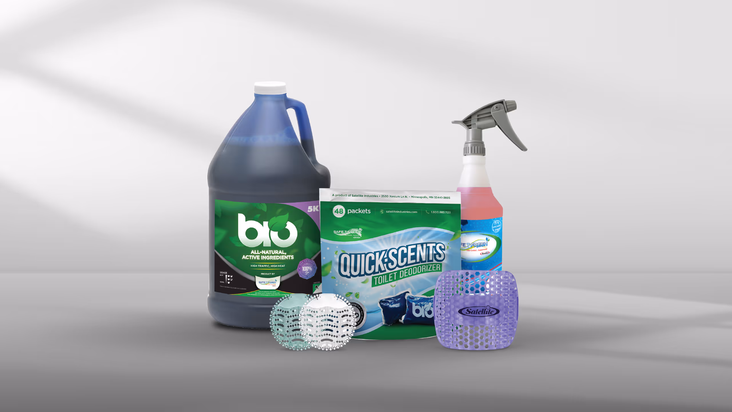 A collection of cleaning products including a large jug, spray bottle, and packaging for scented