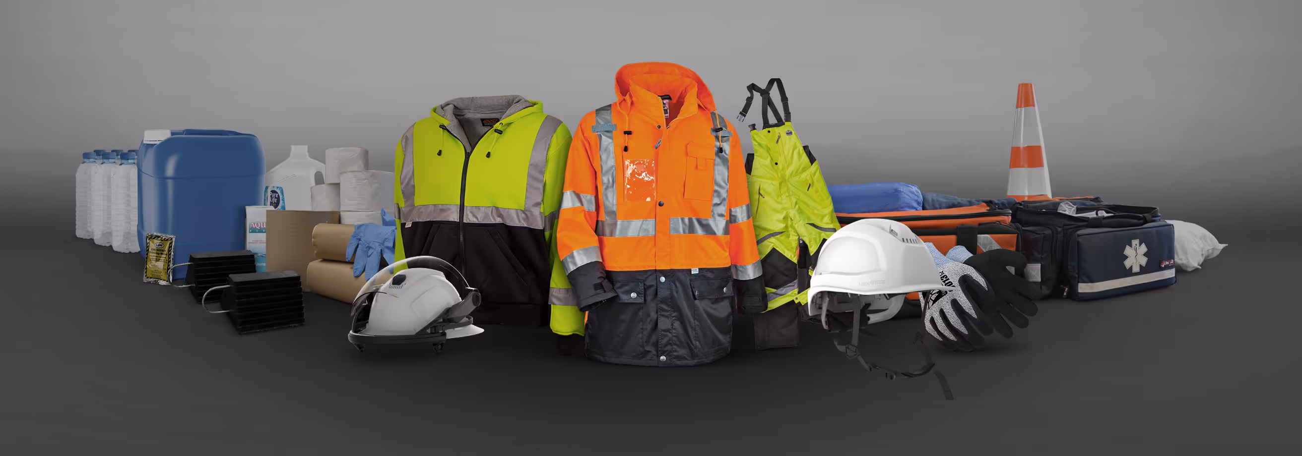 Various safety gear including high-visibility jackets, helmets, gloves, medical bags, and emergency supplies.