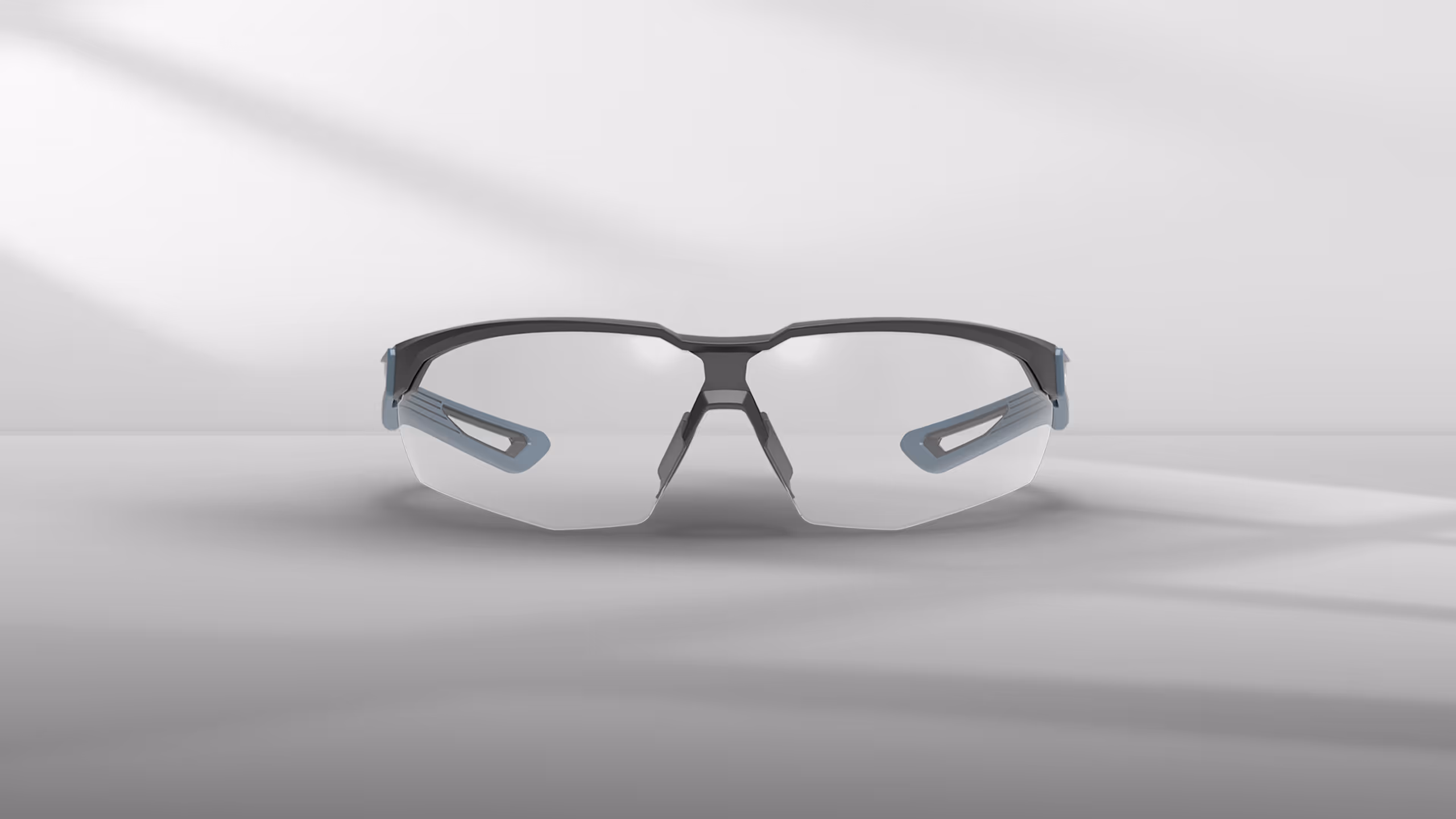 Sporty eyewear with a sleek design, featuring clear lenses and gray accents.