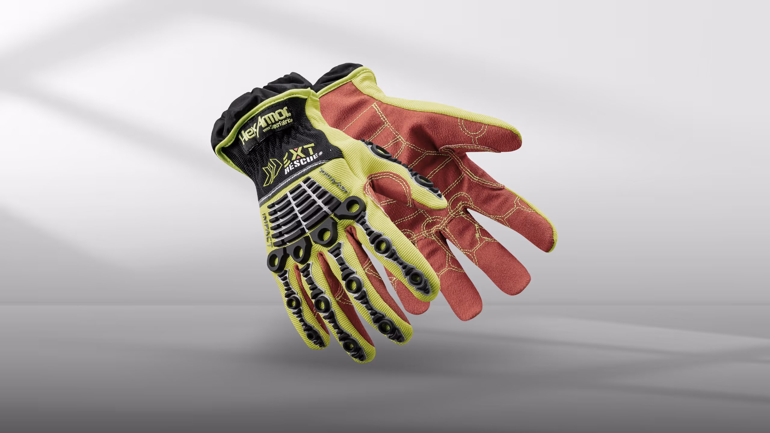 High-visibility work gloves with rubberized grip, featuring red and yellow colors and unique
