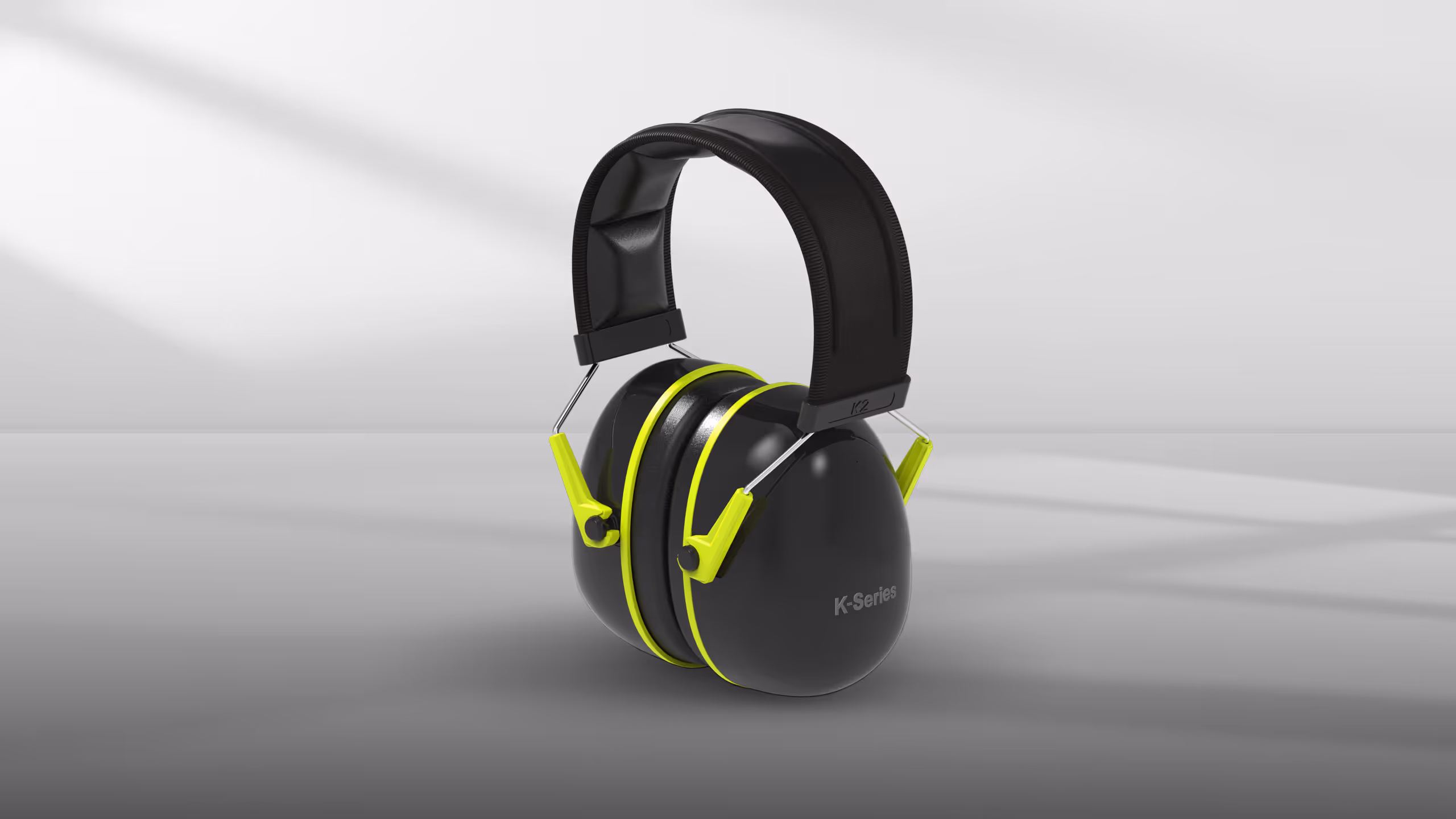 Black headphones with lime green accents, featuring a padded headband and ear cups.
