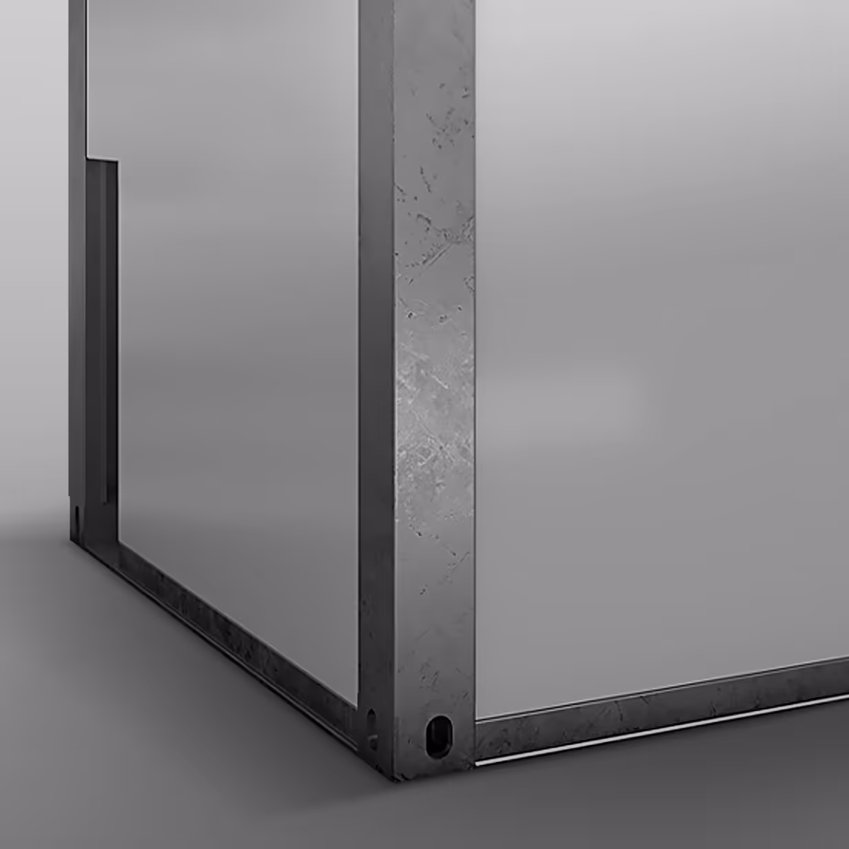 Close-up of a metal corner joint with visible scratches and a smooth panel surface.