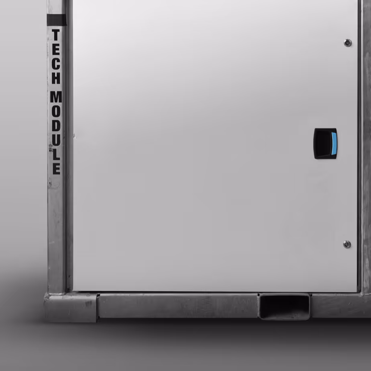 Gray metal tech module cabinet with black handle and vertical Tech Module label on the side.