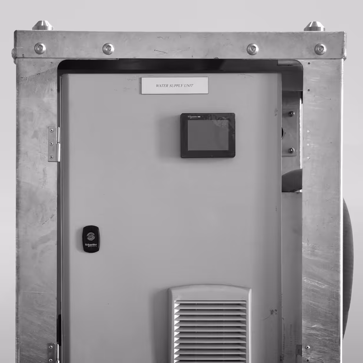 Metal water supply unit panel with touchscreen and ventilation grill, labeled WATER SUPPLY UNIT.