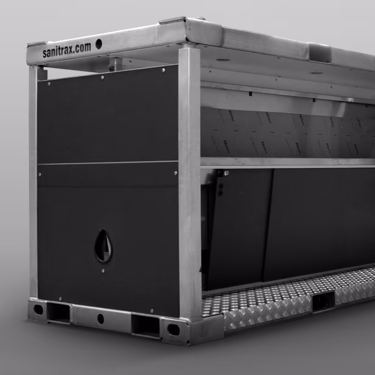 Close-up of a modular industrial metal container with black panels and sanitrax.com branding.