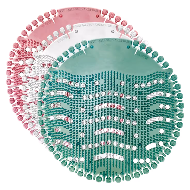 Three layered circular urinal screens with textured grips in pink, white, and green colors.